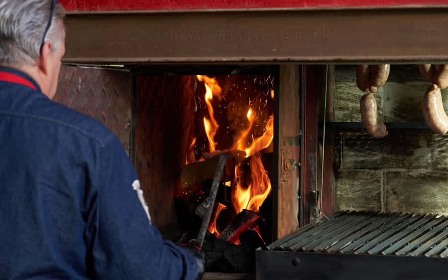 Buenos Aires: Join a Local Family for an Argentine Barbecue - Watching Marcelo work the parrilla